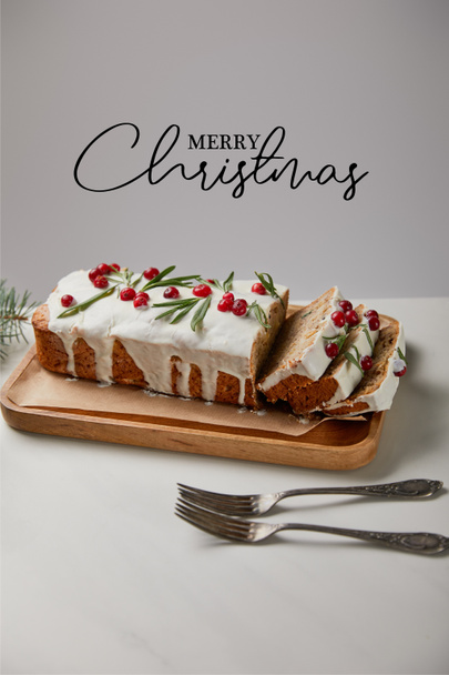traditional Christmas cake with cranberry near forks on white table isolated on grey with Merry Christmas illustration - Zdjęcie, obraz