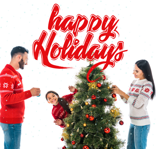 happy daughter decorating christmas tree near parents isolated on white with happy holidays illustration - Φωτογραφία, εικόνα
