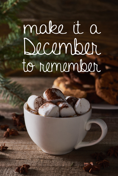selective focus of Christmas cacao with marshmallow on wooden table with make it a December to remember illustration  - Photo, Image