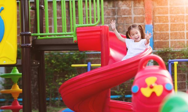 Happy Asian little Girl Playing at Playground outdoors.  - Valokuva, kuva