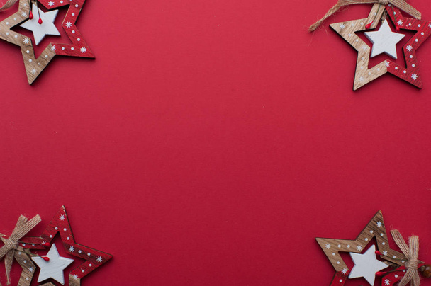 Wooden Christmas Stars on Red Background - Photo, Image