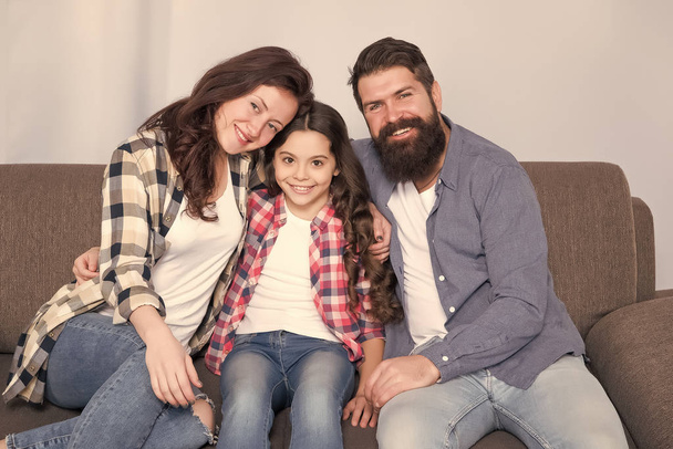happy family relax at home. family weekend. mother and father love daughter. little girl with parents. trust and bonds. bearded man and woman with child. Enjoying time together. you are my family - Photo, image