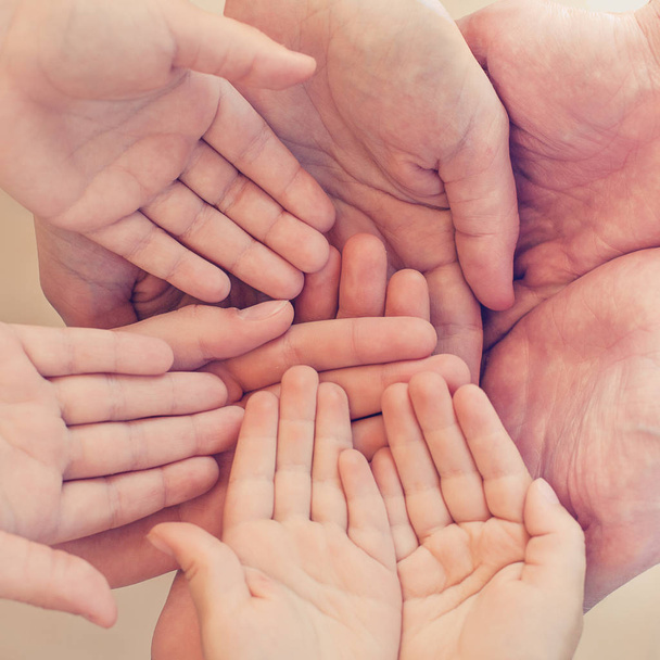 Family and friends concept. Many human hands together, top view - Fotografie, Obrázek