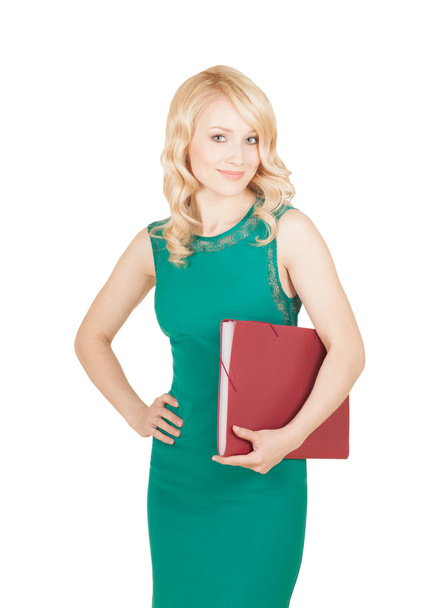 beautiful blonde keeps the red folder in a green dress - Фото, зображення