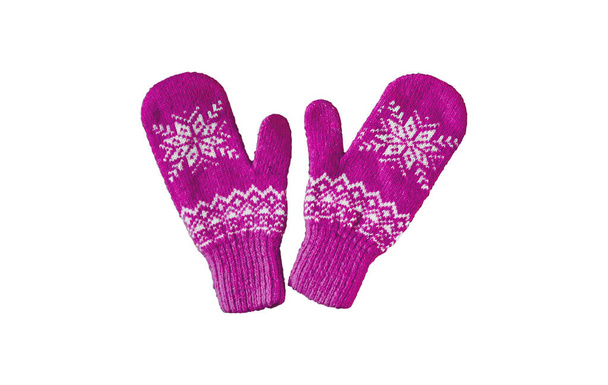 pair of pink lilac purple knitted mittens with christmas pattern isolated on - Photo, Image