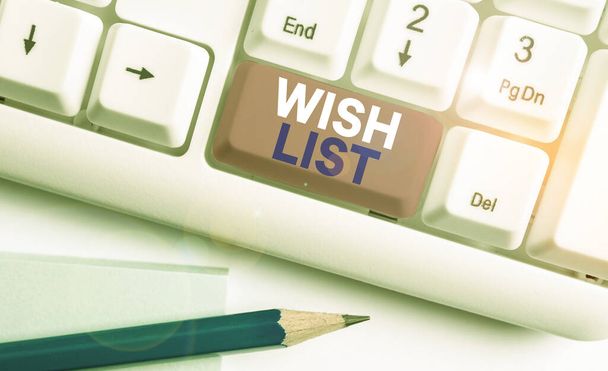 Handwriting text writing Wish List. Concept meaning List of desired but often realistically unobtainable items White pc keyboard with empty note paper above white background key copy space. - Photo, Image