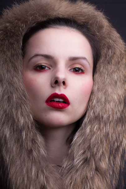 beautiful young girl with red lipstick on her lips - Fotó, kép
