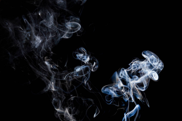 Smoke  on a black background, abstract photo with swirls in the air - Fotoğraf, Görsel