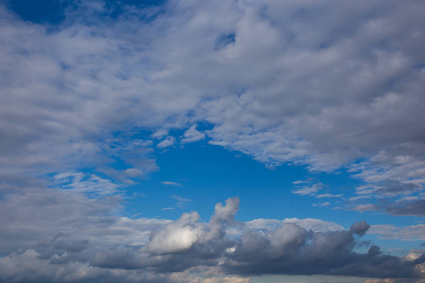 White textured clouds on azure sky, contrasting summer natural background - Foto, Imagen