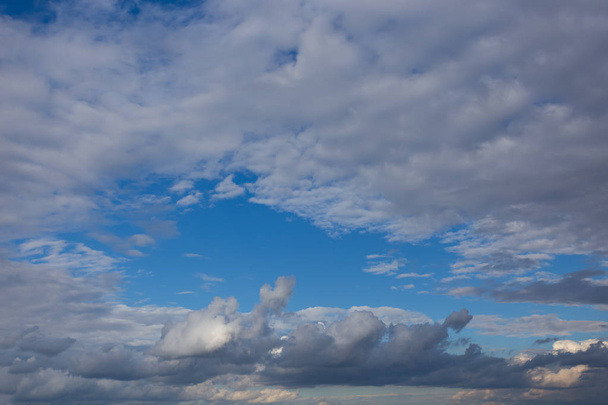 White textured clouds on azure sky, contrasting summer natural background - Foto, Imagem