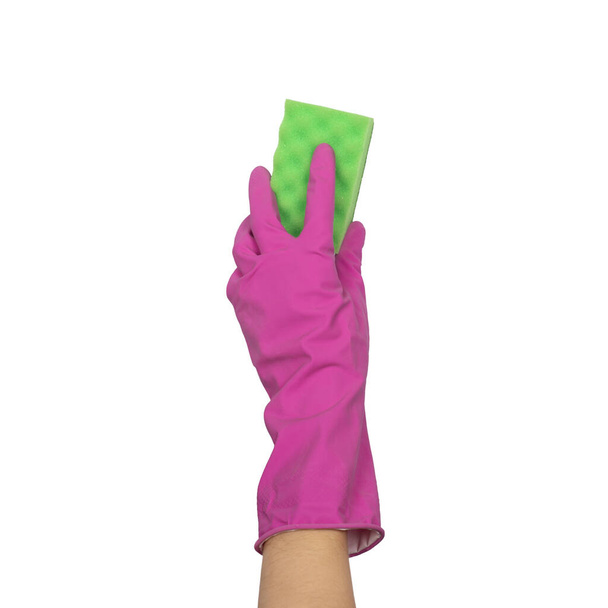 Una mano en un guante sostiene una esponja para lavar y limpiar los platos
 - Foto, imagen