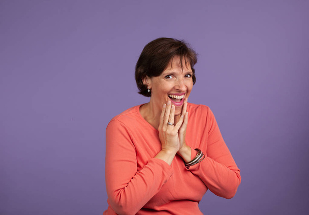 Woman laughing and making mocking gestures.  - Fotó, kép