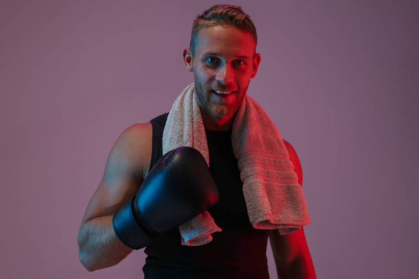 Sports man boxer in gloves with towel. - Photo, image