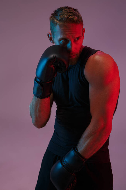 Portrait of a handsome fit muscular boxer man standing - Foto, Imagen
