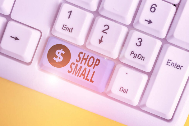 Writing note showing Shop Small. Business photo showcasing nationwide movement that celebrates small businesses every day White pc keyboard with note paper above the white background. - Photo, Image