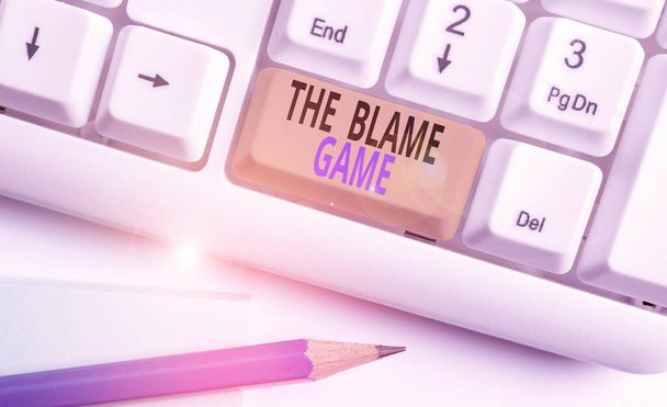 Word writing text The Blame Game. Business concept for A situation when showing attempt to blame one another White pc keyboard with empty note paper above white background key copy space. - Photo, Image