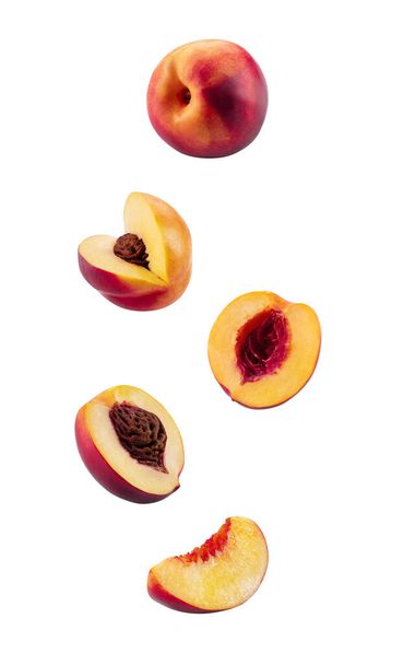 Set of smooth-skinned nectarines with kernels and without them isolated on white background with copy space for text or images. Side view. Close-up. - Photo, Image