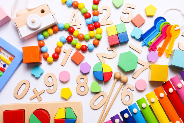 Colorful kids toys on white background. Top view, flat lay. - Fotó, kép