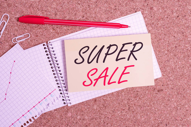 Handwriting text Super Sale. Concept meaning offering exceptional discounts on selected products and services Desk notebook paper office cardboard paperboard study supplies table chart. - Fotoğraf, Görsel