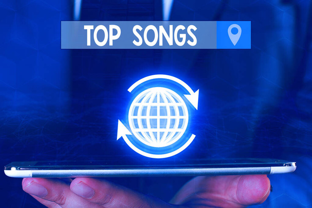 Text sign showing Top Songs. Conceptual photo recorded song that becomes broadly popular or wellknown. - Photo, Image