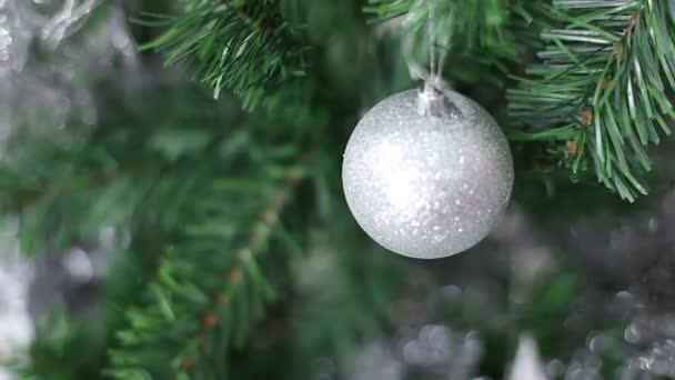 christmas and New Year holidays background with christmas balls - silver christmas balls and christmas tree - Footage, Video
