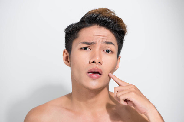 Handsome Asian man pointing his face close up portrait studio on white background - Foto, Imagem