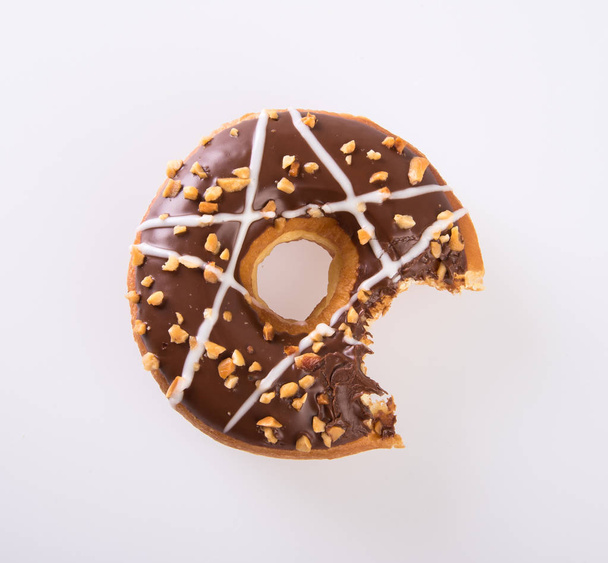 donut or donut with missing bite on a background new. - Foto, Imagem