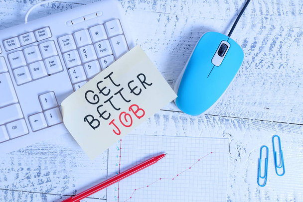Text sign showing Get Better Job. Conceptual photo Looking for a high paying occupation Stress free work Writing equipments and computer stuffs placed above classic wooden table. - Fotoğraf, Görsel