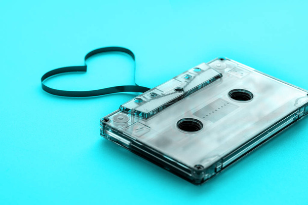 Old audio cassette on a blue background. vintage - Foto, Imagen