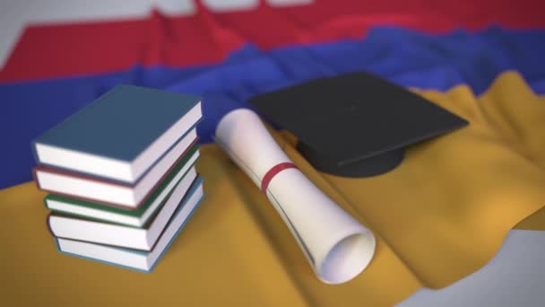 Mezuniyet şapkası, Ermeni bayrağı üzerine kitaplar ve diploma. Ermenistan 'da yüksek öğrenim ile ilgili kavramsal 3D animasyon - Video, Çekim