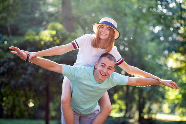Happy young couple boyfriend and girlfriend having fun outdoors  - Valokuva, kuva