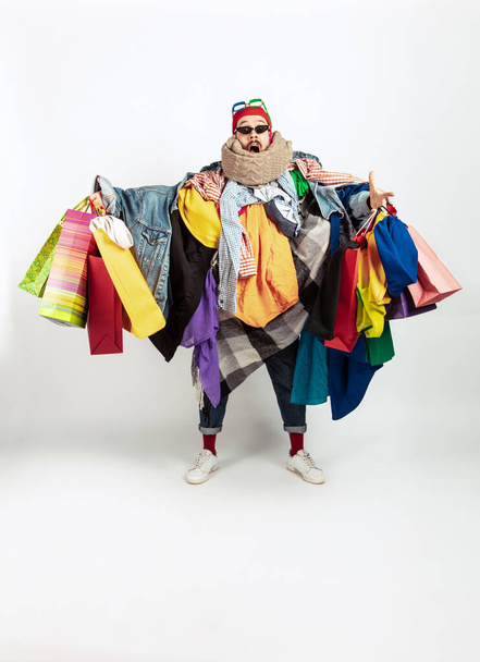 Man addicted of sales and clothes, overproduction and crazy demand - Фото, зображення