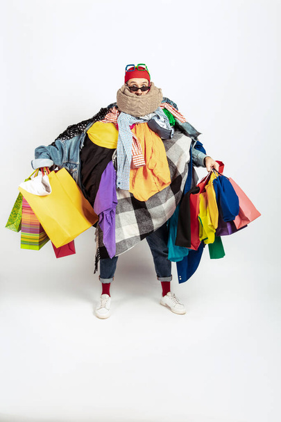 Man addicted of sales and clothes, overproduction and crazy demand - Фото, изображение