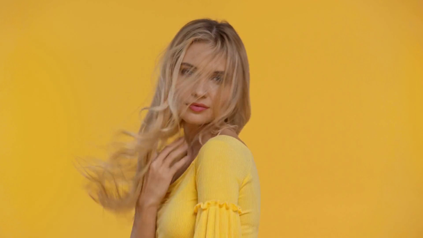 smiling woman posing isolated in yellow - Footage, Video