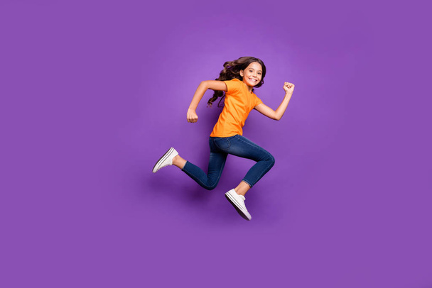 Full length body size profile side view of her she nice attractive purposeful glad cheerful cheery wavy-haired girl jumping running marathon isolated over lilac purple violet pastel color background - Φωτογραφία, εικόνα