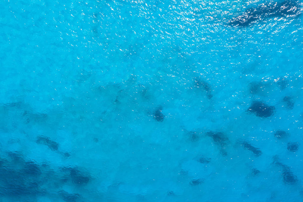 Aerial view calm sea, turquoise water texture. - Фото, изображение