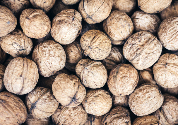Natural walnut in shell background pattern texture. - Foto, Bild