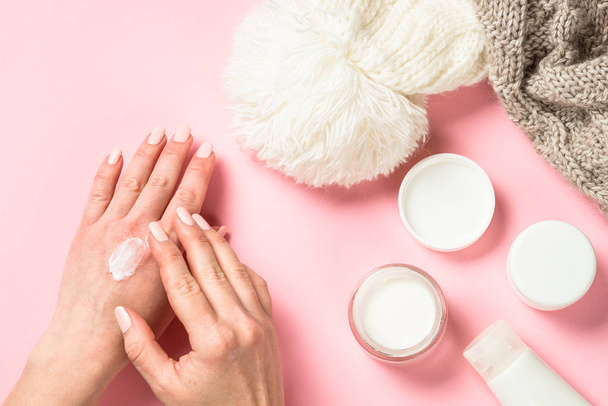 Woman using winter cream for hands. - Photo, Image