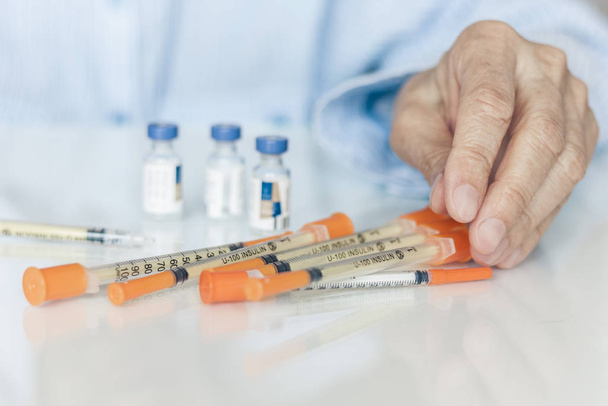medical syringes for insulin for diabetes in woman hand. - Фото, зображення