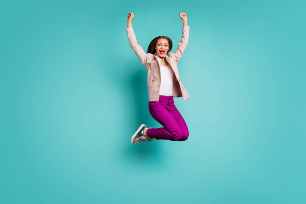 Full length body size view of her she nice attractive cheerful cheery girl jumping up having fun celebrating holiday isolated on bright vivid shine vibrant blue green turquoise color background - Photo, Image
