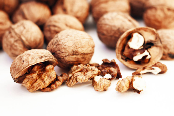 Whole walnuts kernels on white background. - Valokuva, kuva