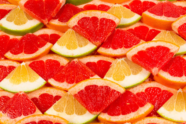 Pomelo a grapefruit plátky pozadí.  - Fotografie, Obrázek