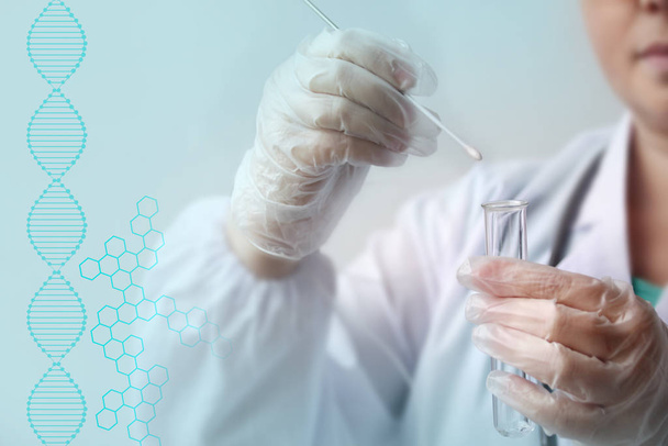 laboratory assistant in gloves puts a sample for DNA analysis on a cotton swab into a glass test tube, a scientific, police investigation and medical examination concept, close-up - Foto, Bild