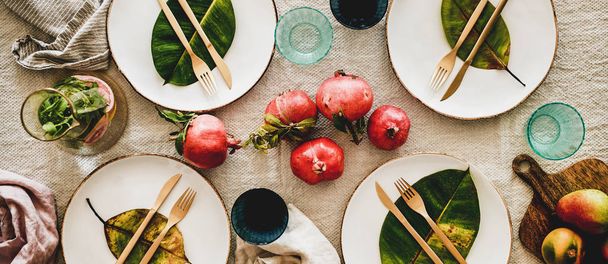 Fall table setting with leaves for family gathering, wide composition - Photo, Image