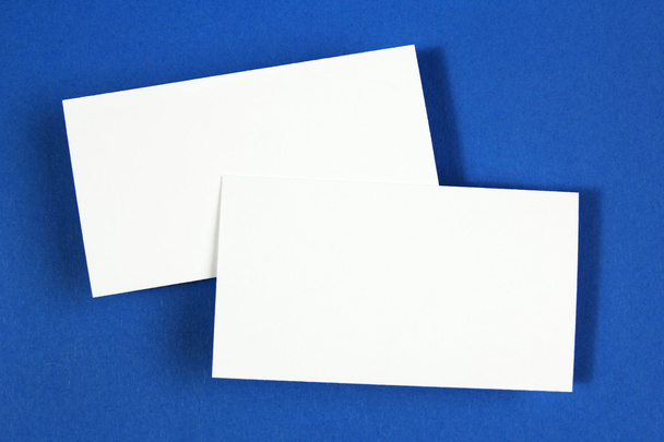 Two blank business cards on blue paper background - Photo, Image