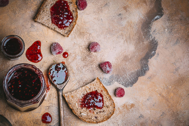 homemade toast with raspberry jam - Фото, изображение