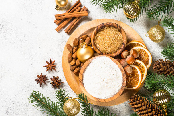 Christmas baking background with spices on white. - Photo, Image