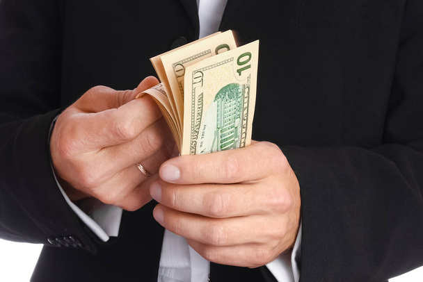 Business man holding money on white background - Φωτογραφία, εικόνα