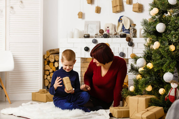 mother and her son at Christmas photo session  - Photo, Image