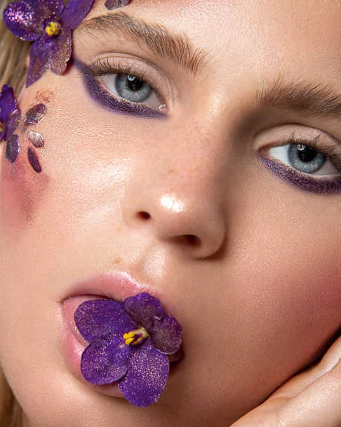 beauty portrait of a girl with flowers on face - Fotoğraf, Görsel